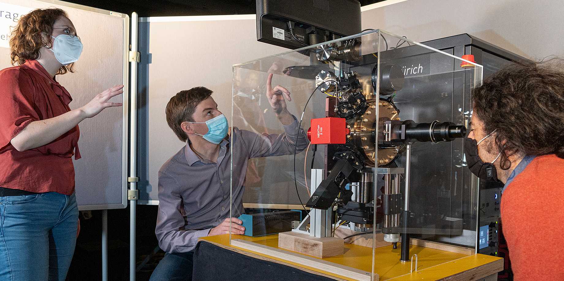 The ion trap exhibit prototype at Technorama being tested by the team. From left: Natascha Hedrich, Ilia Sergachev from ETH Zurich, Marco Miranda from Technorama in Winterthur. (Photo: ETH Zurich/ Heidi Hostettler)