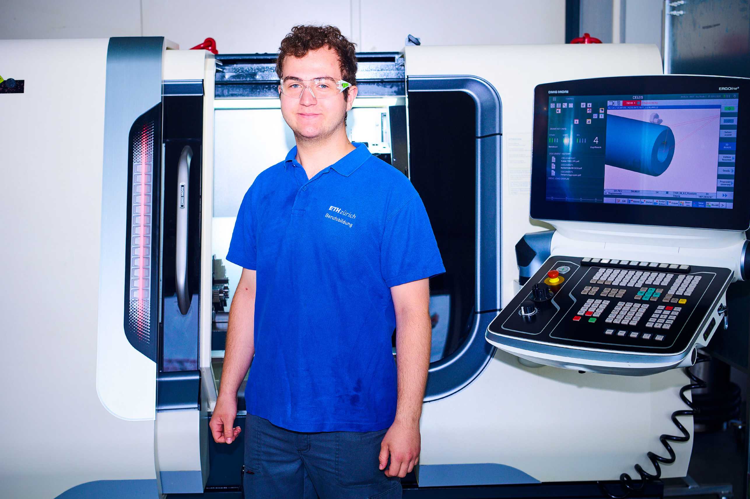 Salvatore in front of the machine used to produce the aluminium cylinder